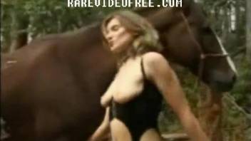 Blond-haired zoophile fucks a horse in front of her BF