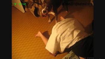 Mature blonde woman getting throated by a kinky dog