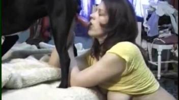 Slutty woman gets intimate with the black dog