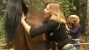 Horny blonde gets ready to take a stallion's cock